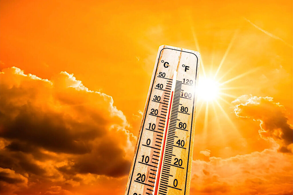 Värmebölja med termometer och sol.
